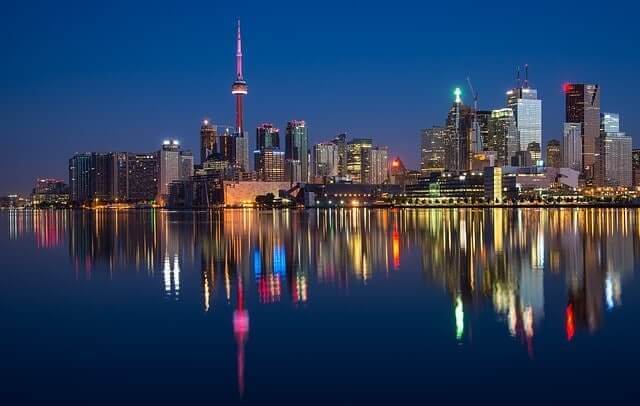 A view of the Toronto skyline at night, visible after moving from Europe to Canada.