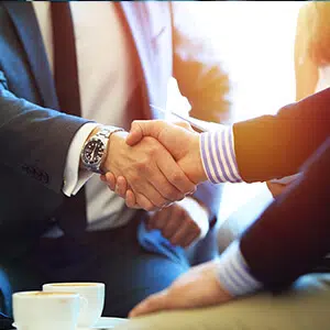 Business men shaking hands at meeting