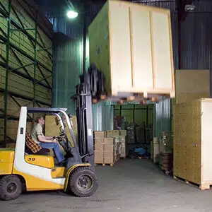 Fork-lift moving storage boxes