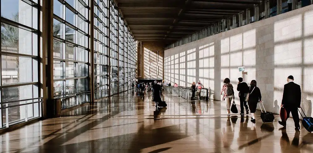 International Relocation - People Walking Through An Airport